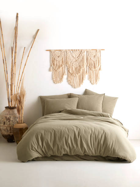 istock Wooden framed comfortable bed with many pillows, blanket 1774111956
