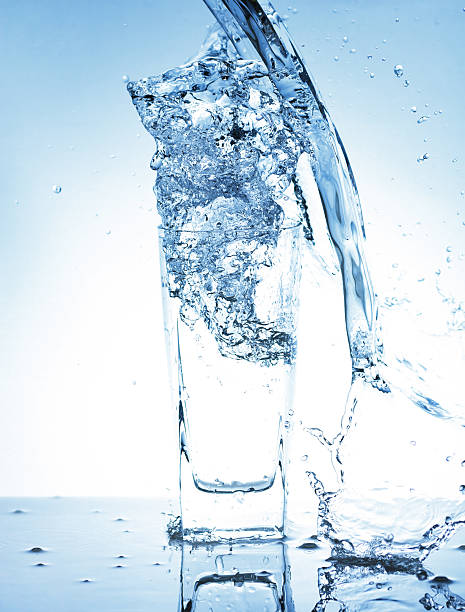 istock Water splash out of glass 177411286