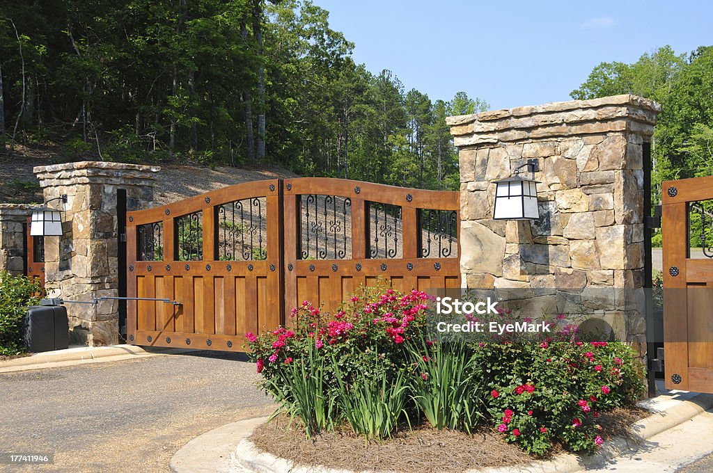 Security Gate Stately Entrance to New Gated Community Boundary Stock Photo