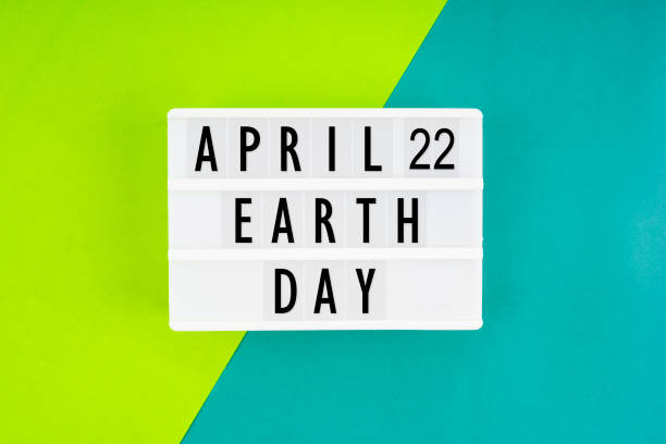 April 22nd Earth day. White lightbox with letters. April 22nd Earth day. White lightbox with letters on a green background. 22nd april stock pictures, royalty-free photos & images
