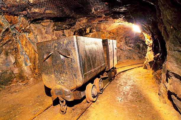 istock Carts on a track in a mine tunnel 177412281