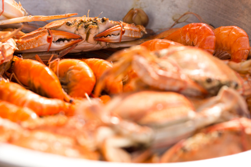 Raw seafood of crabs and shrimp in steamer.