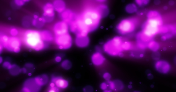 Abstract purple blurred holiday background with magical bokeh of glowing bright light energy small particles of flying dots on a black background.