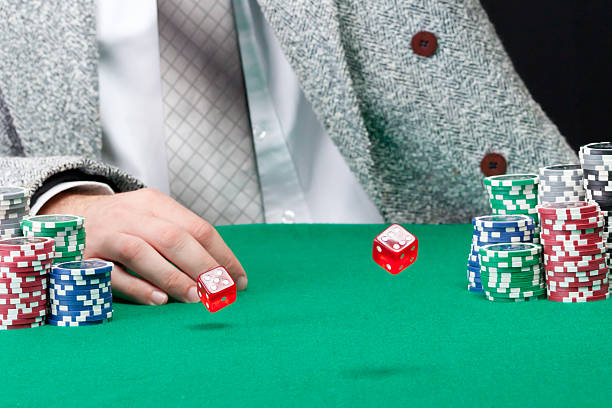 istock Red dice are rolling on casino table 177413107
