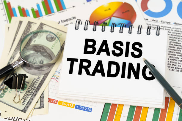 istock On the table are business charts, dollars and a notepad with the inscription - Basis Trading 1774131721