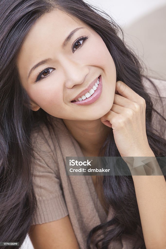 Beautiful Chinese Oriental Asian Woman Smiling A beautiful young Chinese Asian woman with a wonderful toothy smile 20-29 Years Stock Photo