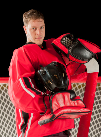 Goalie portrait posing with his gear and helmet off