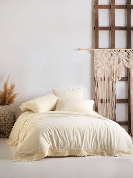 istock Wooden framed comfortable bed with many pillows, blanket 1774137854