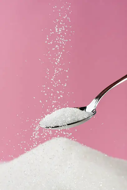 Sugar pouring to a pile