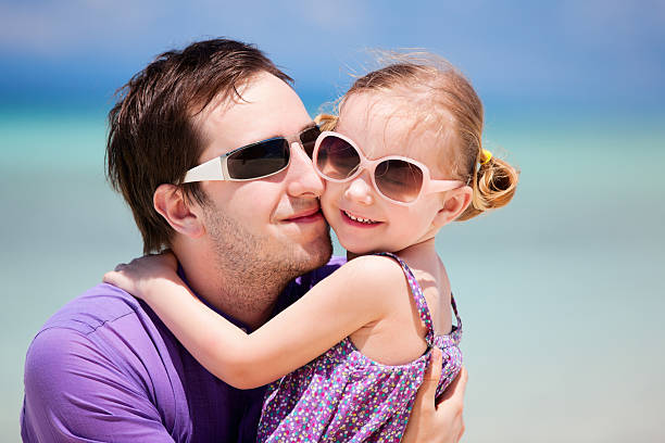 istock Father and daughter at beach 177414879