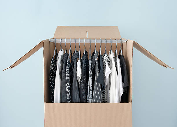 Clothes in a wardrobe box for easy moving stock photo