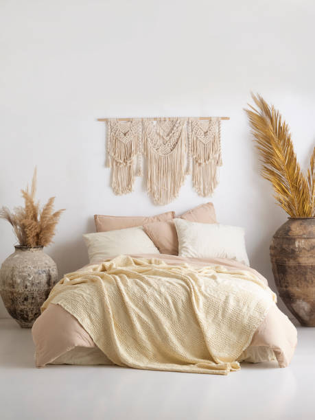 istock Wooden framed comfortable bed with many pillows, blanket 1774149503