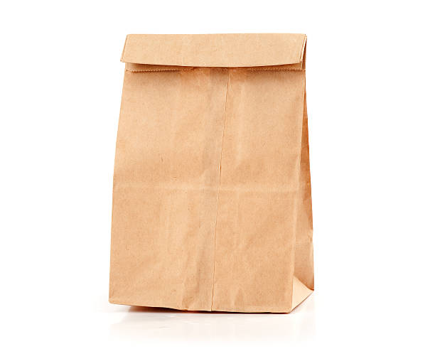 istock Brown paper lunch-bag folded closed on a white background 177415168