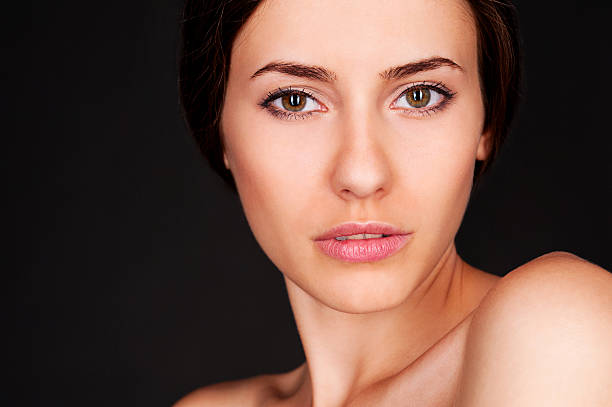 istock beautiful woman looking at camera 177415272