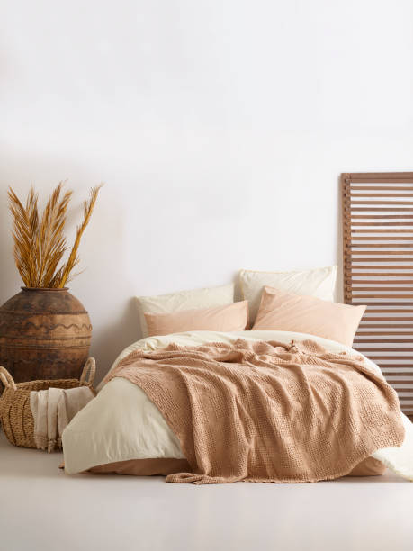 istock Wooden framed comfortable bed with many pillows, blanket 1774156998