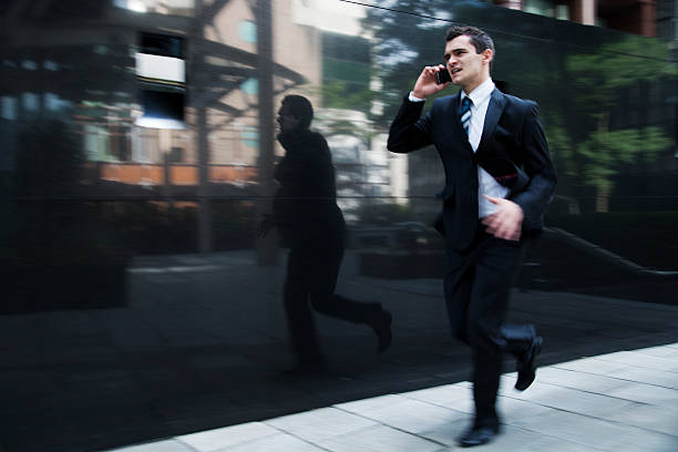 istock Man in Suit Running, on Mobile Phone 177416019