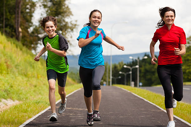 istock Mother with kids running outdoor 177416155