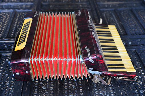 Old accordion on rustic wooden surface