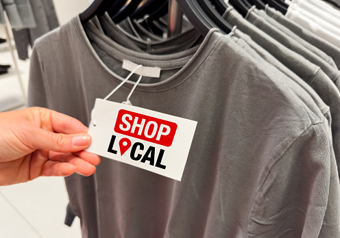 Shop local clothing label on shirt at apparel store