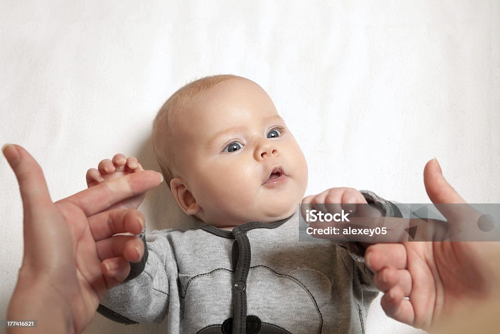 newborn child and mother Cute newborn baby tries to grab mother's hands Baby - Human Age Stock Photo