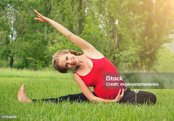 Healthy Pregnant Woman Doing Yoga In Nature Stock Photo - Download Image Now - Abdomen, Activity, Adult