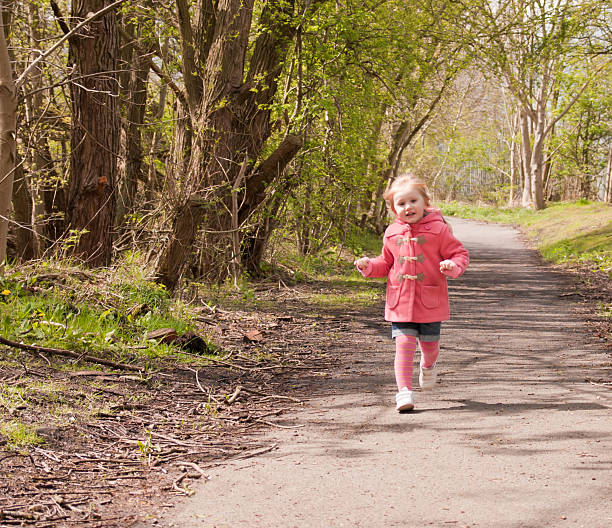 Young girl running stock photo