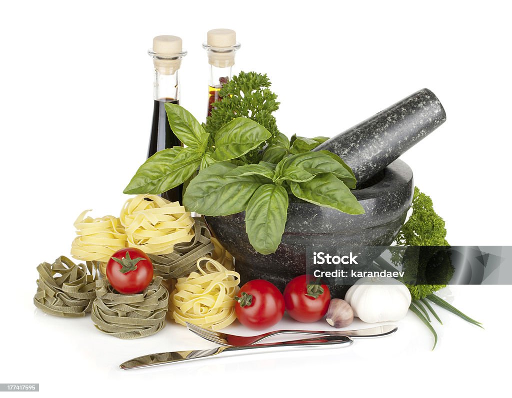 Italian food "Italian food: pasta, tomatoes, herbs in mortar. Isolated on white background" Olive Oil Stock Photo