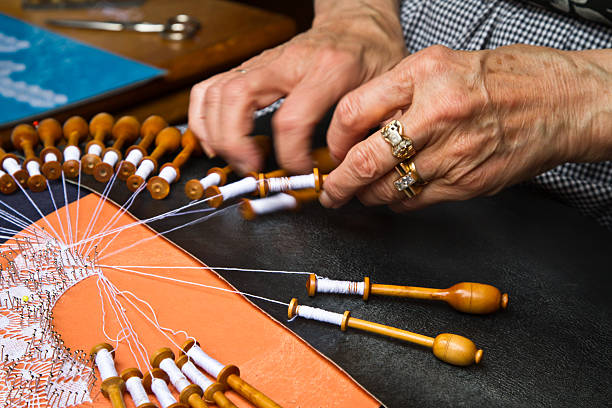 istock Old woman working on bobbin lace 177418025