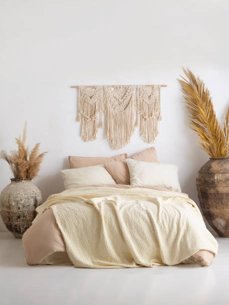 istock Wooden framed comfortable bed with many pillows, blanket 1774182445