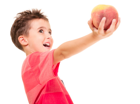 Little naughty boy outstretch the peach isolated on white