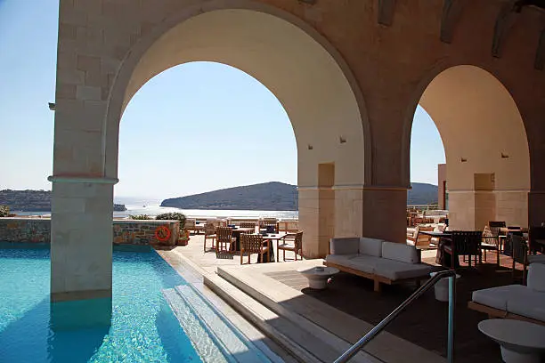 Beautiful Mediterranean sea view with arch pool terrace on summer luxury resort (Greece)