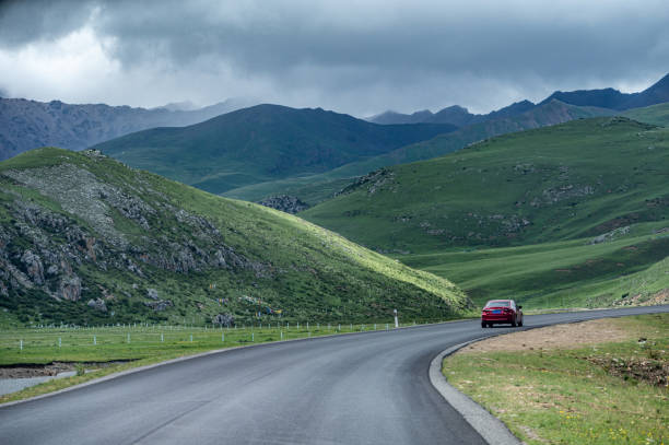 istock Road on plateau meadow in cloudy weather 1774197830
