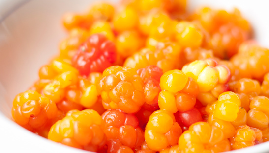 Close up of cloudberry berries, a rhizomatous herb native to alpine and arctic tundra and boreal forest
