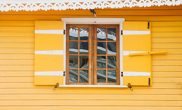 istock Old Wood Window in Bright Yellow Wall 177420329