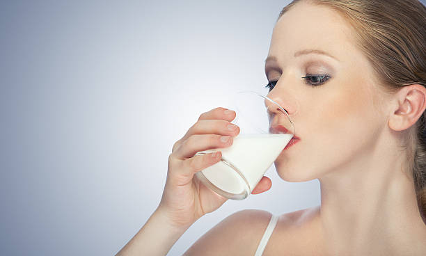 istock beautiful healthy girl drinking milk 177420453