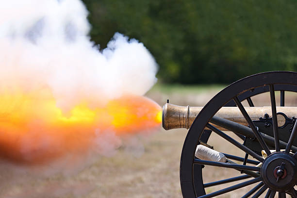 Civil War Cannon Firing A close up shot of a Civil War cannon firing at a civil war re-enactment. cannon artillery photos stock pictures, royalty-free photos & images