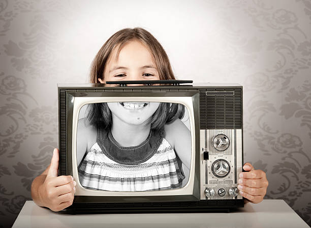 istock girl with old retro television 177420925