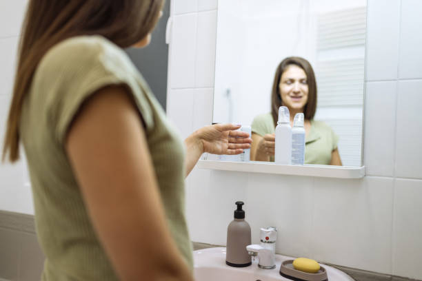 istock Woman holding spray in bathroom 1774213530