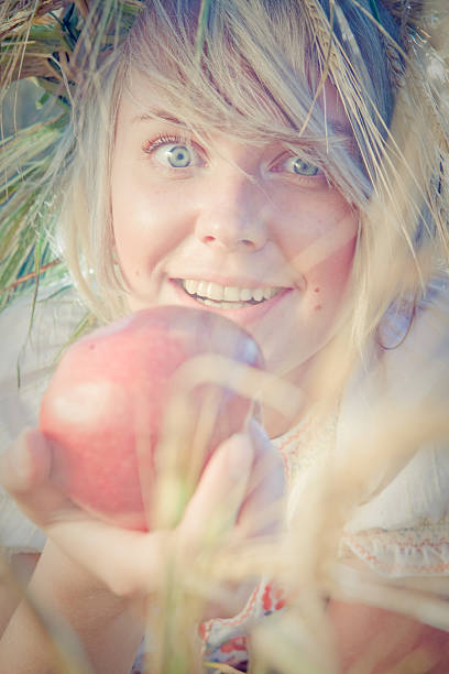 istock young woman on wheat field 177421383