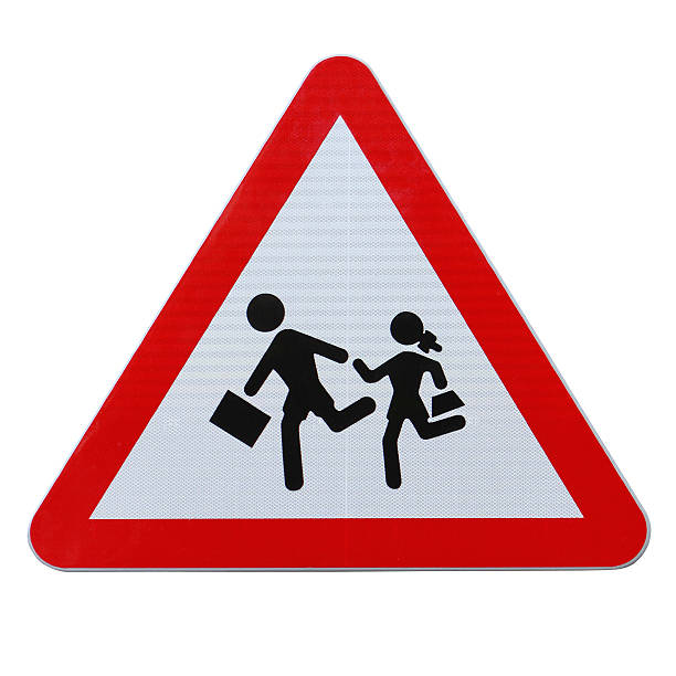 An actual road sign in Spain on school children crossing (isolated on white with clipping path)