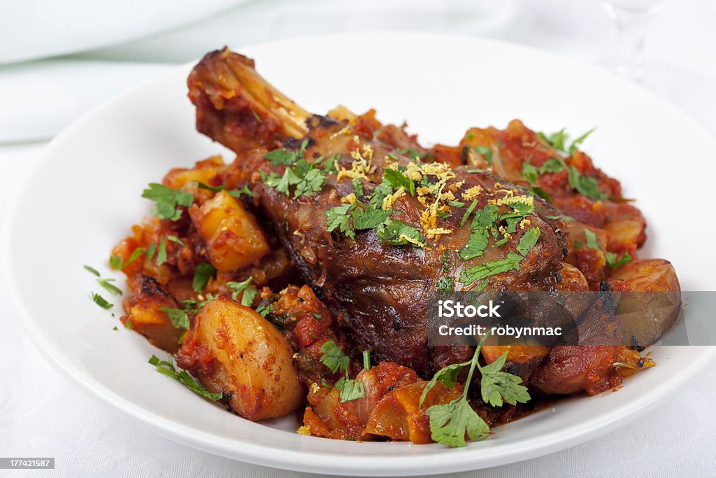 Lamb Shank Dinner "Lamb shank casserole, with parsley and lemon." Lamb - Meat Stock Photo