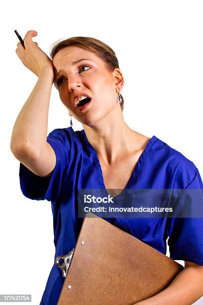 Stressed Out Overworked Doctor Or Nurse On White Background Stock Photo - Download Image Now