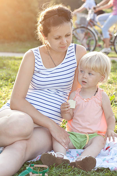 istock daughter and her mother talking in the park 177422206