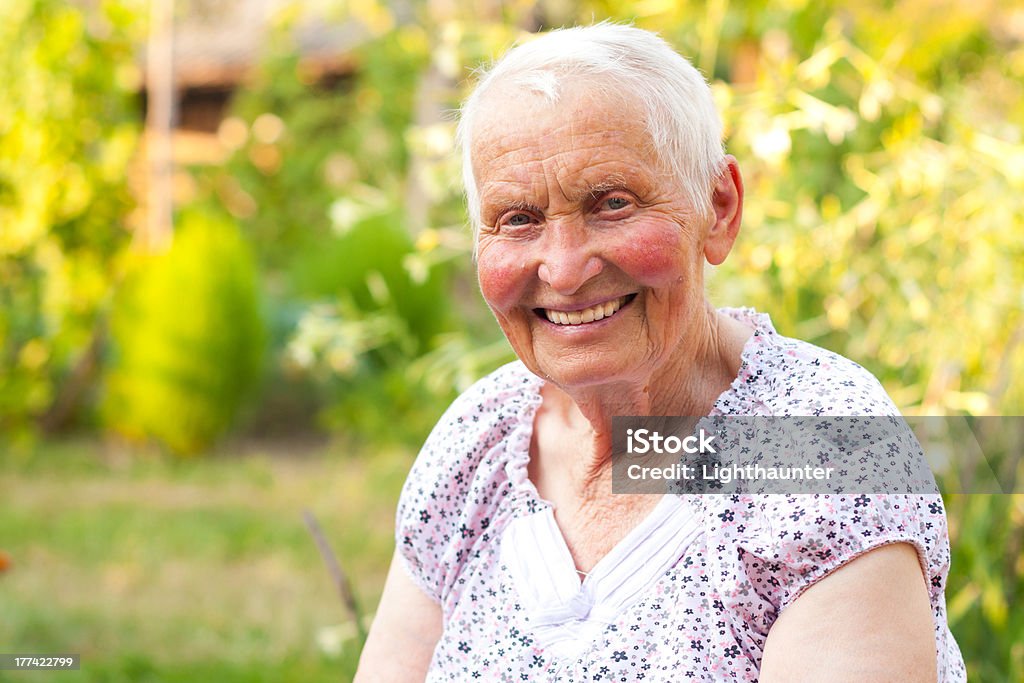 Smiling senior woman Elderly woman with blue eyes having toothy smile. Active Seniors Stock Photo