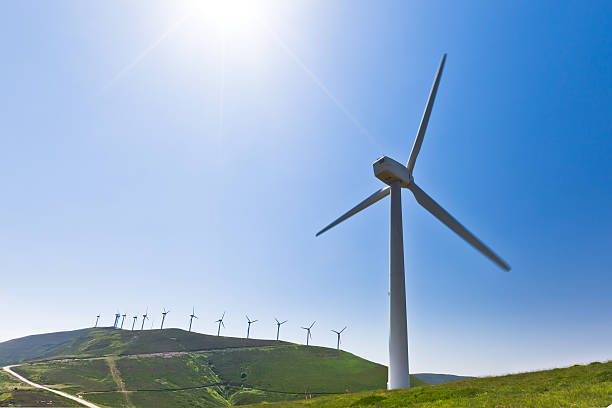 Wind turbine with more behind, horizontal shot stock photo