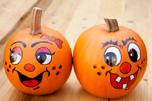Painted pumpkins on a wooden tabel
