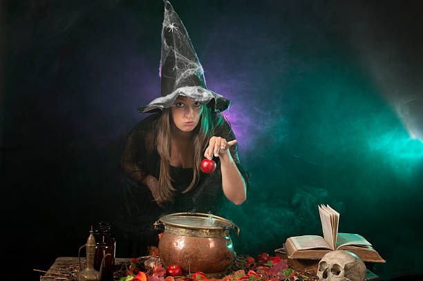 istock Halloween witch on smoke green and purple background 177422948