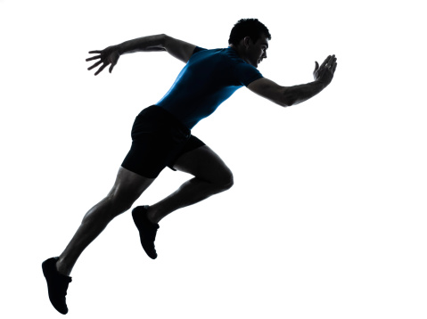 one caucasian man runner running sprinter in silhouette studio on white background