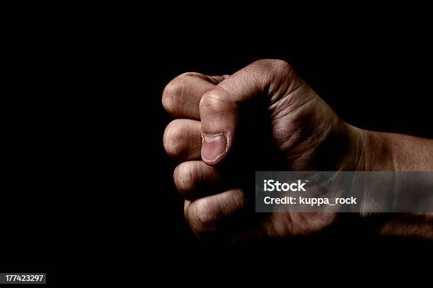 Clenched Кулак — стоковые фотографии и другие картинки Кулак - Кулак, Тёмный, Ударять кулаком