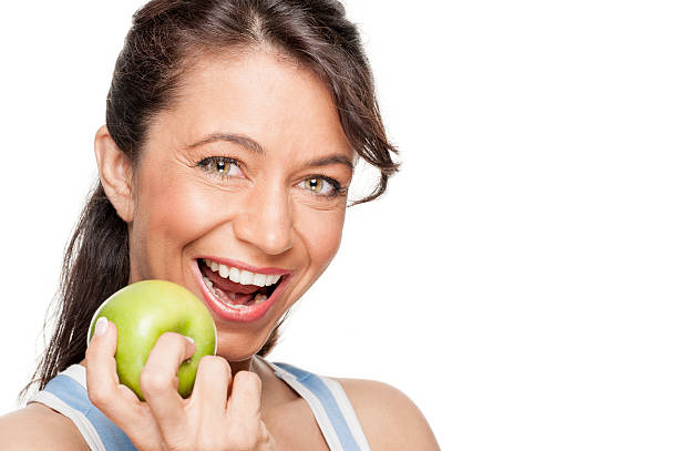 istock Woman with green apple 177423439